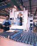 History of China Gear Motions - employee in gear manufacturing facility